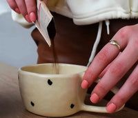 Pour the powder into a cup.